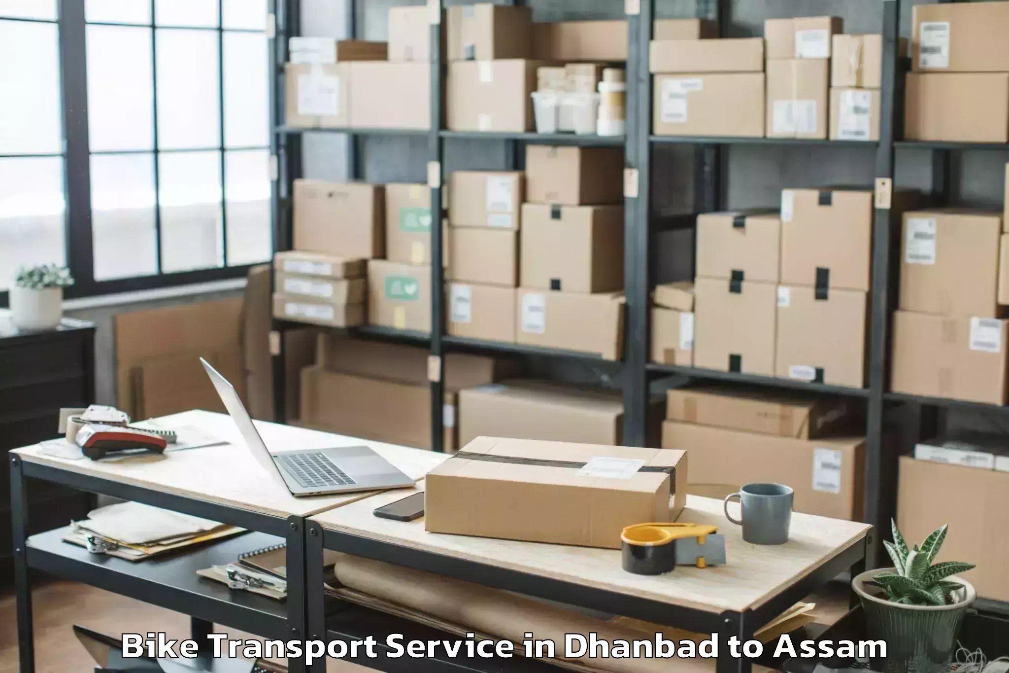 Reliable Dhanbad to Duliajan Bike Transport